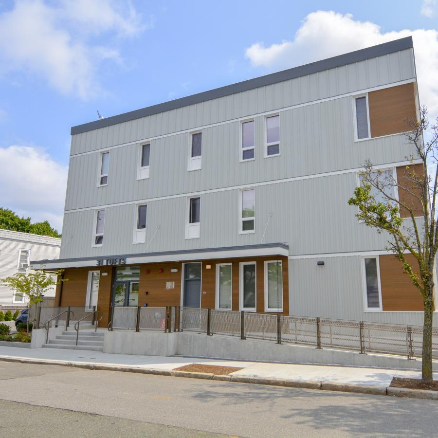 Find your perfect fit at 31 Tufts Landing a building with a street and trees