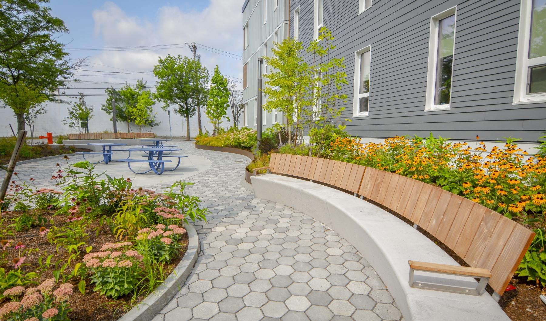 The essence of exceptional living a small patio with a bench and flowers